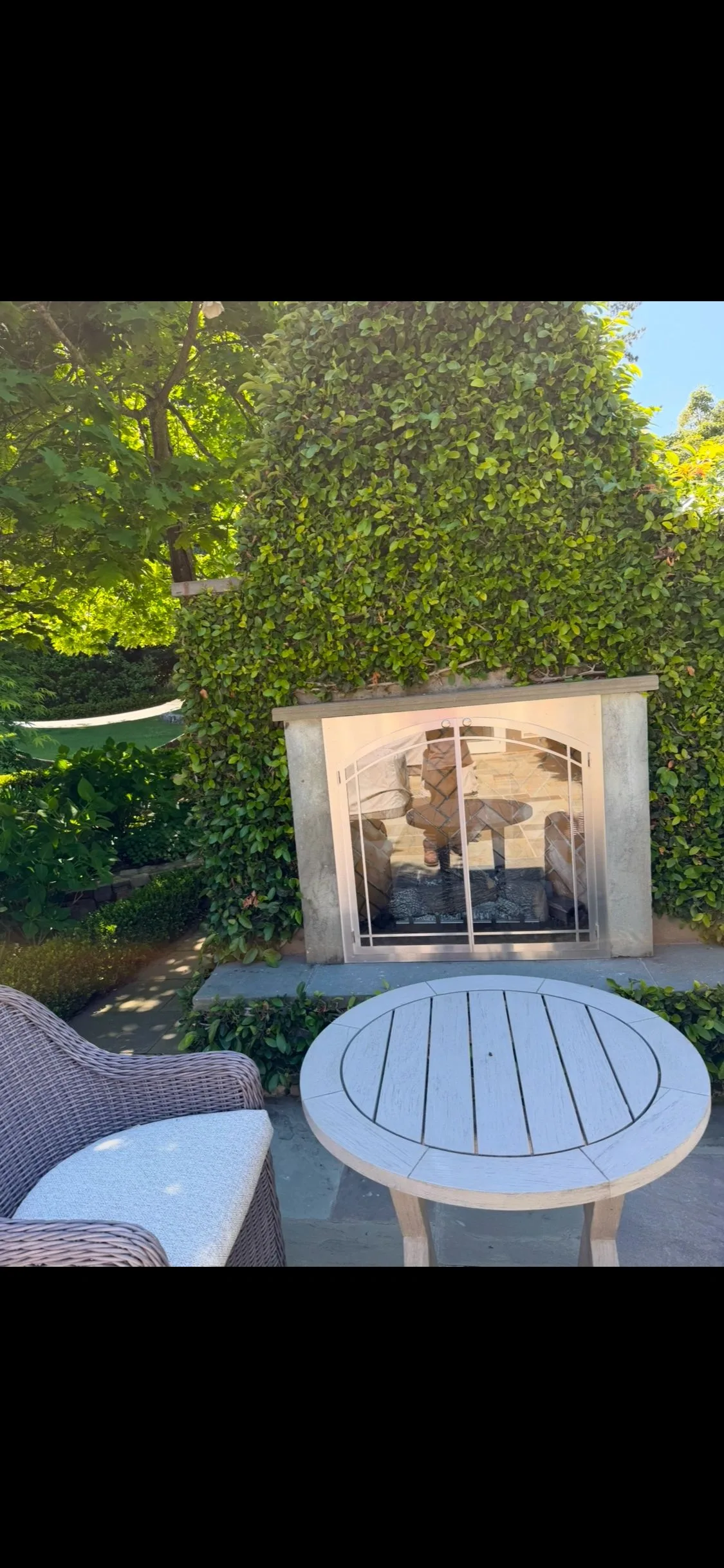 Completed outdoor fireplace with an arched firebox